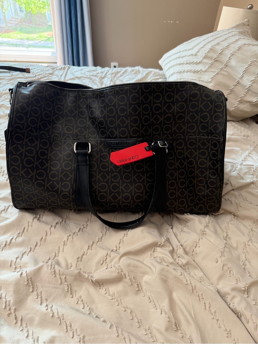 Calvin Klein Brown Monogram Duffel with Black Trim and Red Tag